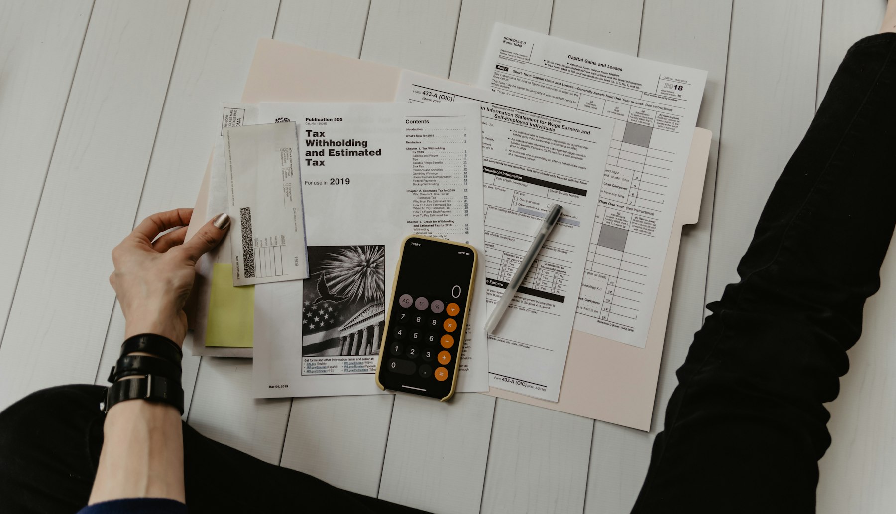 Business documents and calculator on a desk