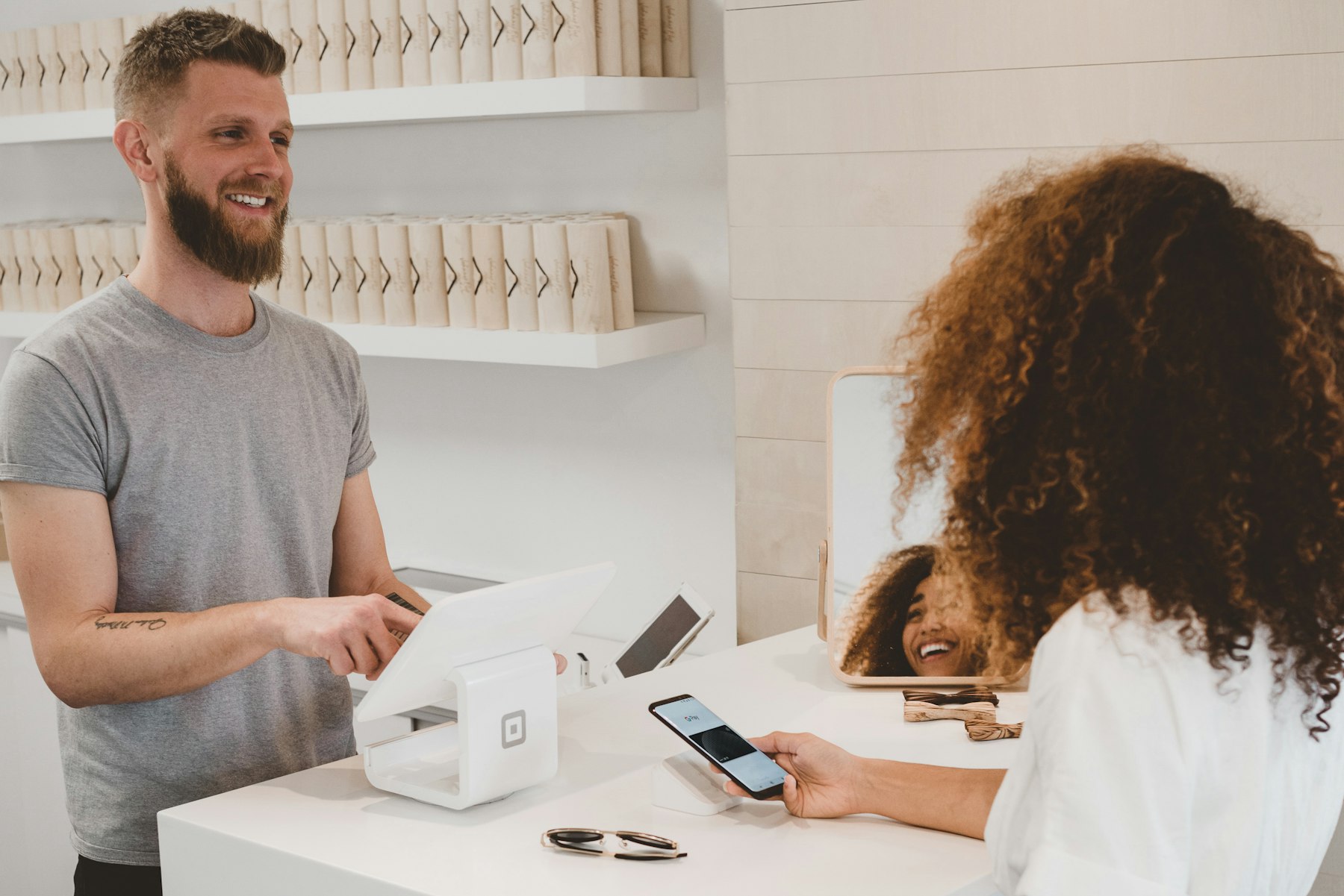 Small business owner taking a payment